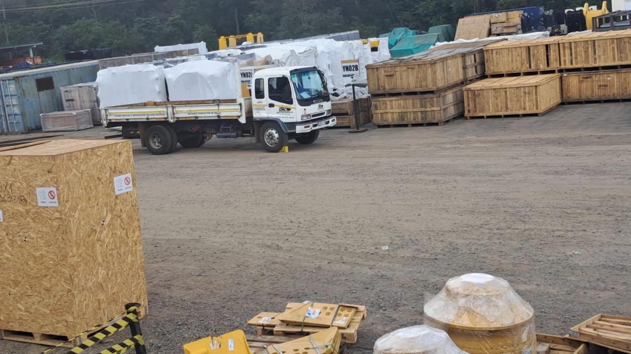 Industrial crate cargo secured on Mcutter flatbed truck